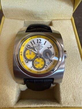 Invicta Silver Chronograph Watch with Yellow Accents and Black Strap